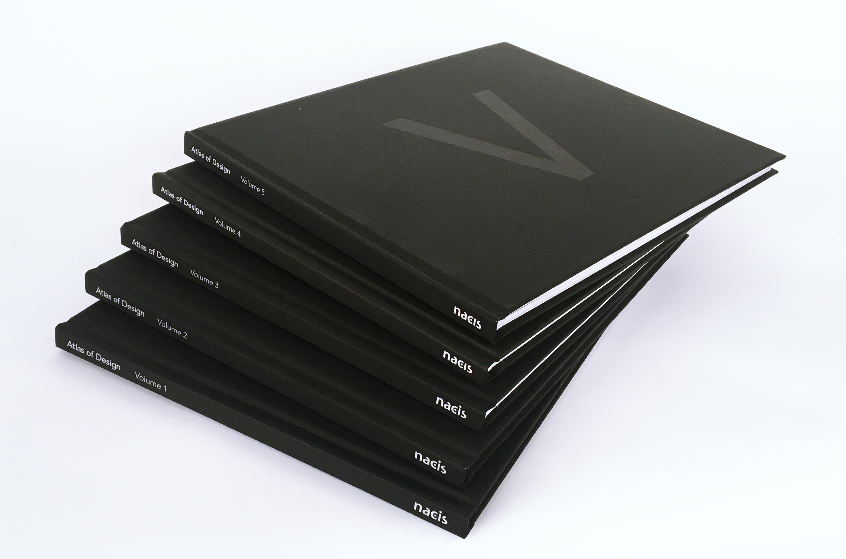 Stack of Atlas of Design Volumes 1 through 5 on a white background