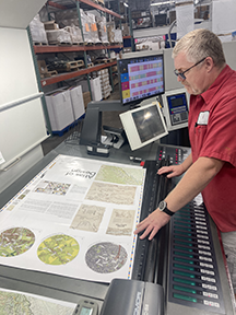 Doug checking ink density with the color bars at the bottom of the sheet